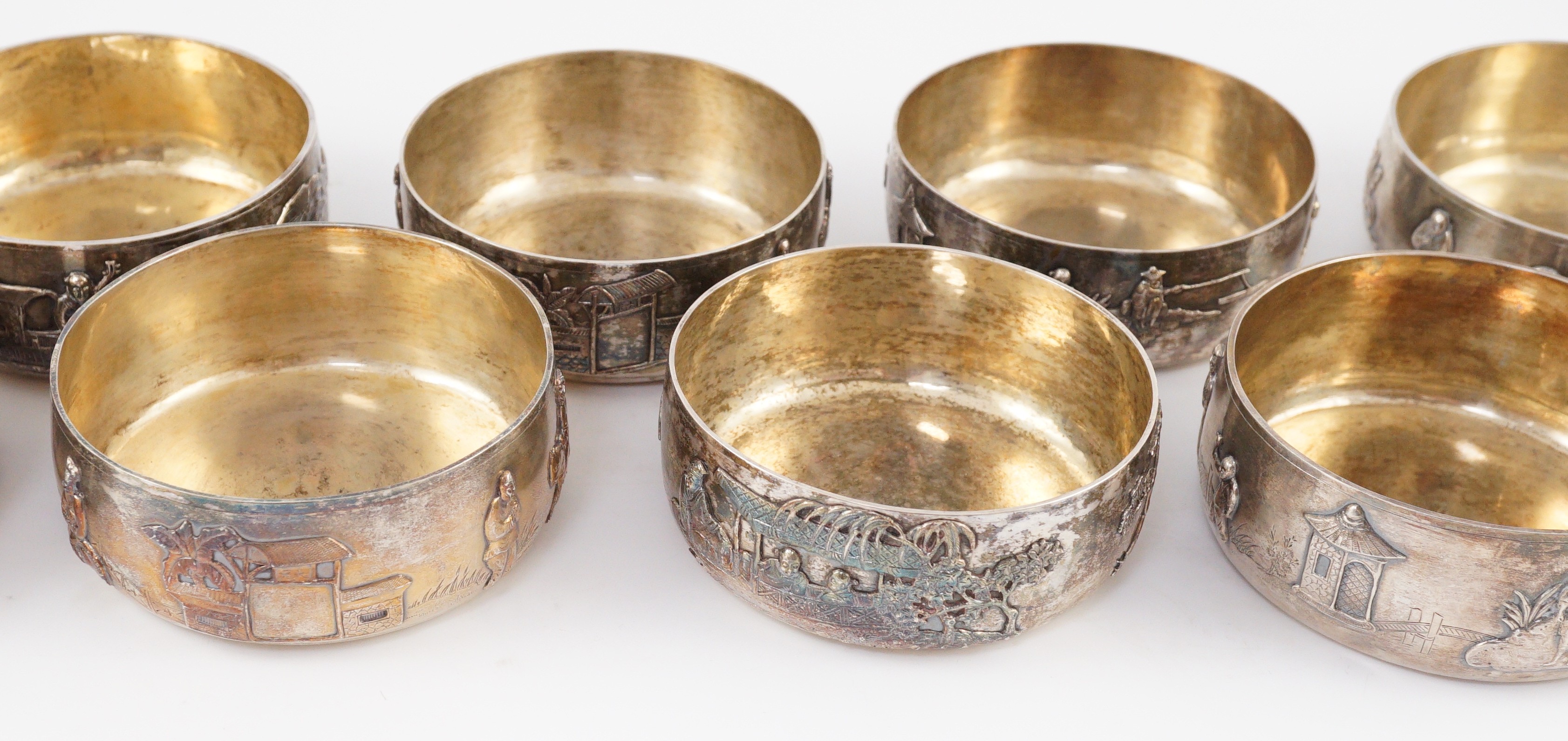 A set of four Chinese Export silver finger bowls, by Wang Hing, Hong Kong and one other set of four Chinese Export silver finger bowls